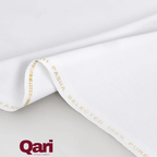 White fabric with gold text 'SELECTED 100% PURE' on edge, soft texture close-up