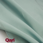 Soft mint green fabric with gentle folds, ideal for clothing or home textiles